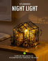 LED-lit display of Rolife Cathy's Flower House miniature greenhouse