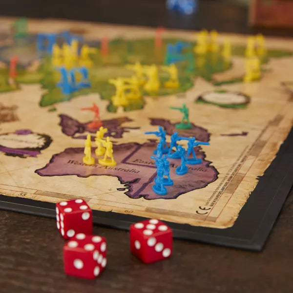 Close-up of Risk dice and cards for strategic conquest gameplay